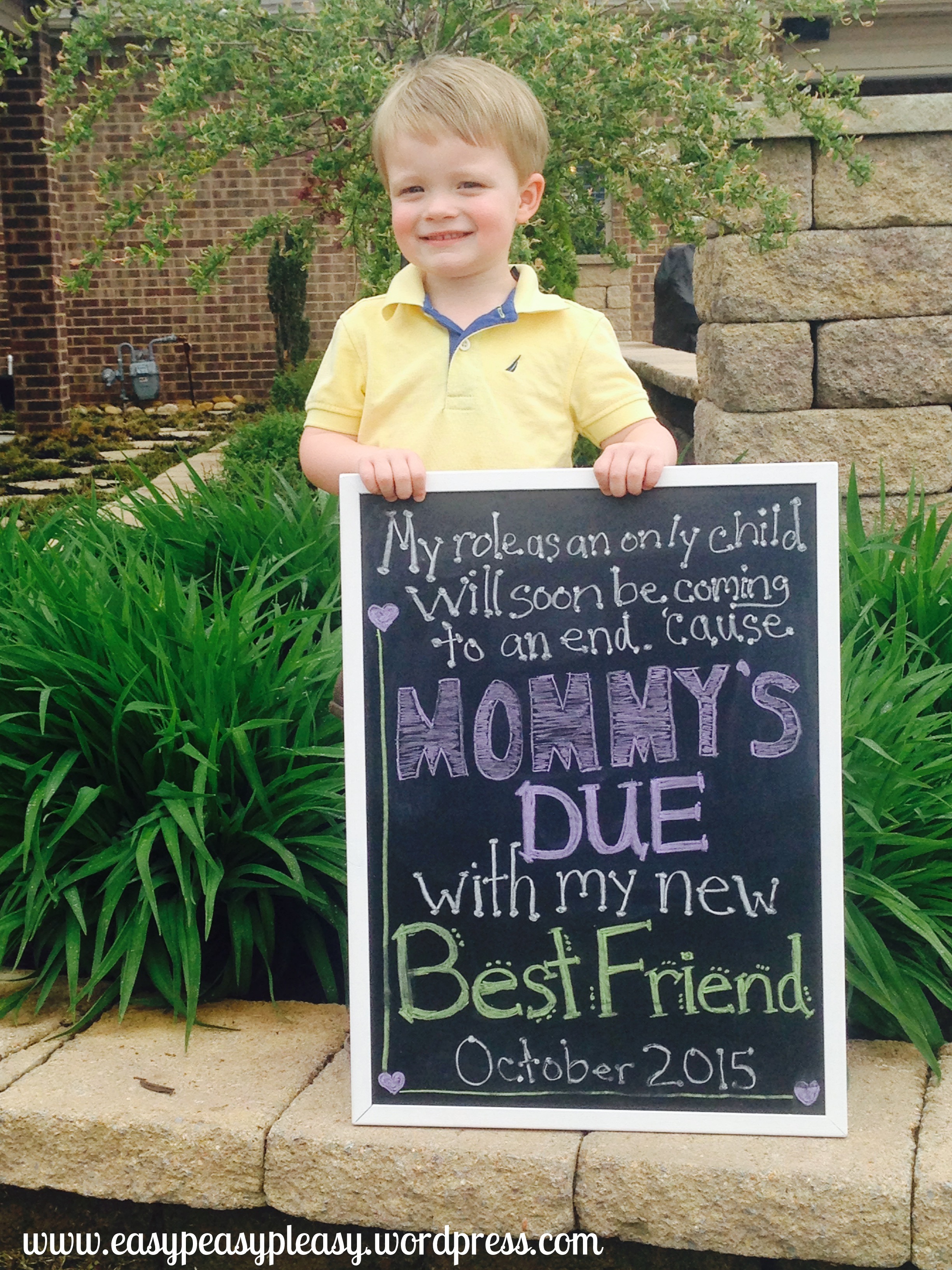 big brother anouncing his mommy is pregnant with a diy chalkboard sign